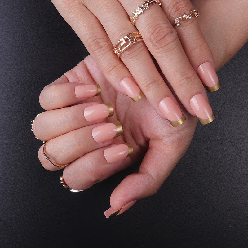 Elegant French Tip Press-On Nails with Gold Accent Bowlift