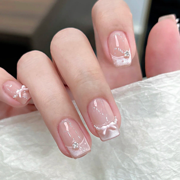 Elegant French Tip Press-On Nail Art with Bow Accents Bowlift