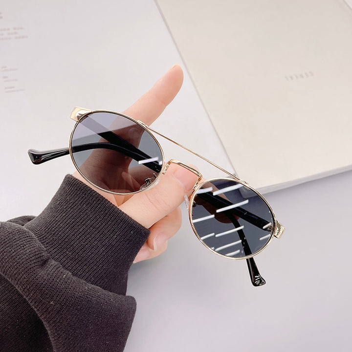 Ladies fashionable sunglasses in stylish round design with golden accents Bowlift