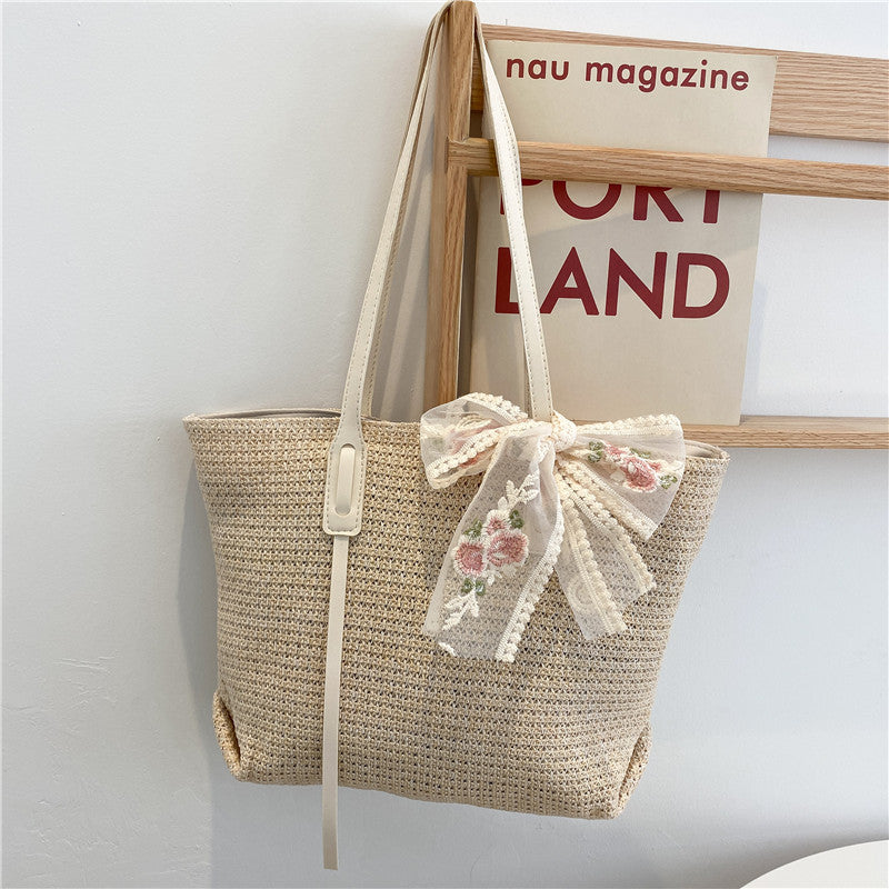 Elegant Woven Straw Tote Bag with Decorative Bow