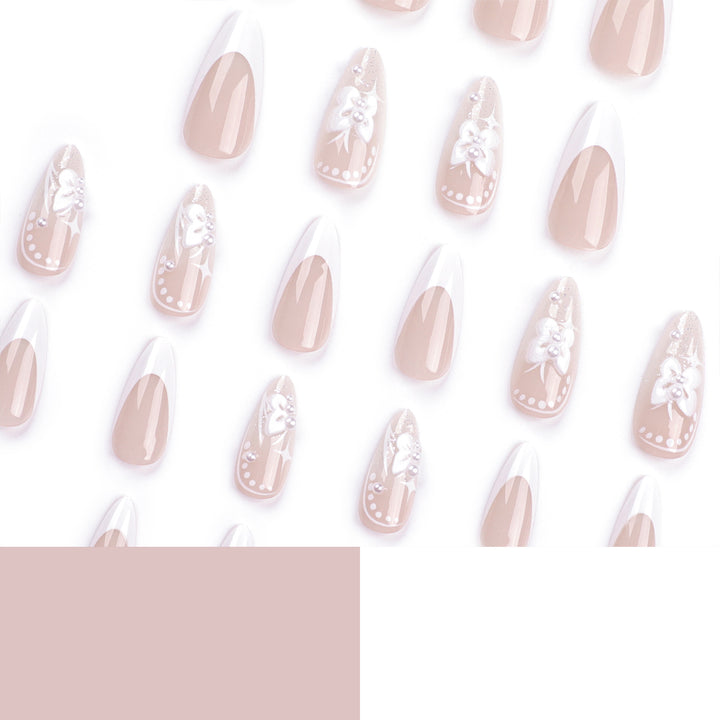 Artful stiletto nails with floral designs and glitter accents Bowlift