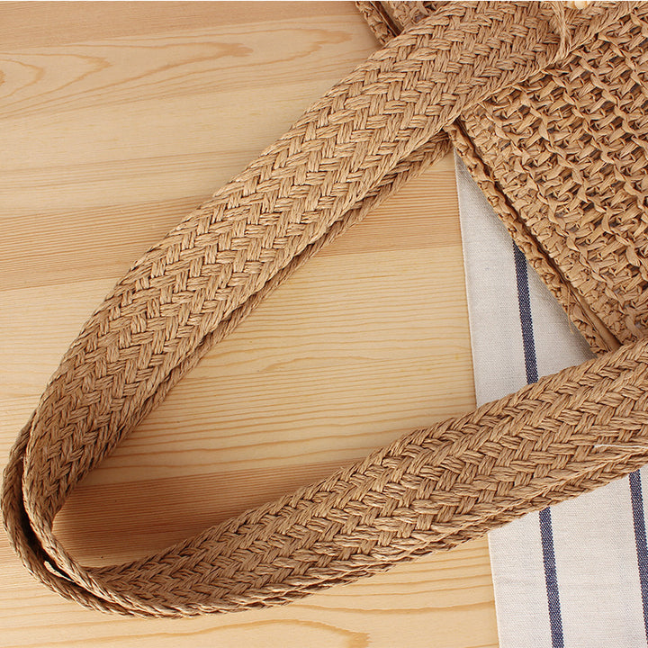 Eco-friendly straw tote bag with elegant tassel detail Bowlift