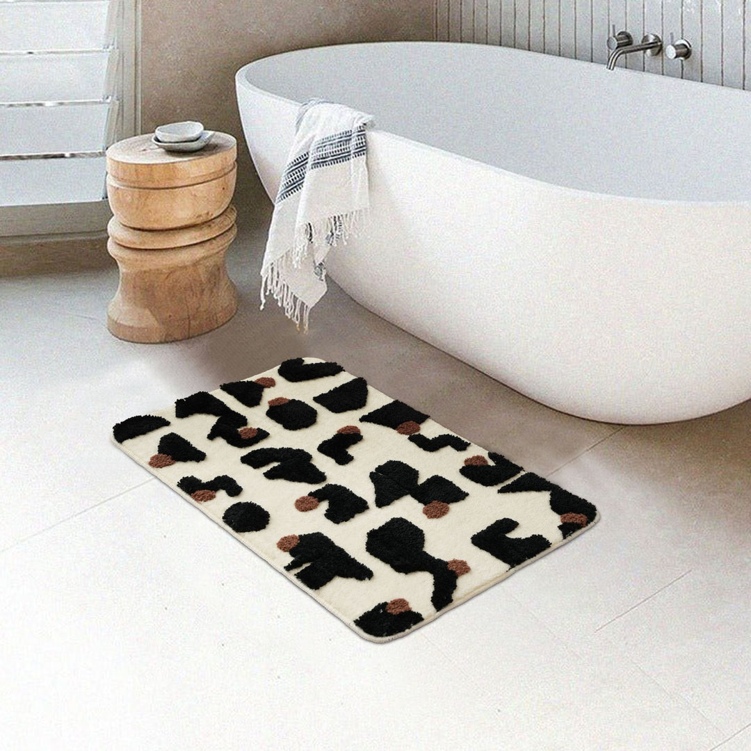Tufted bathroom mat in abstract leopard pattern with soft high pile Bowlift