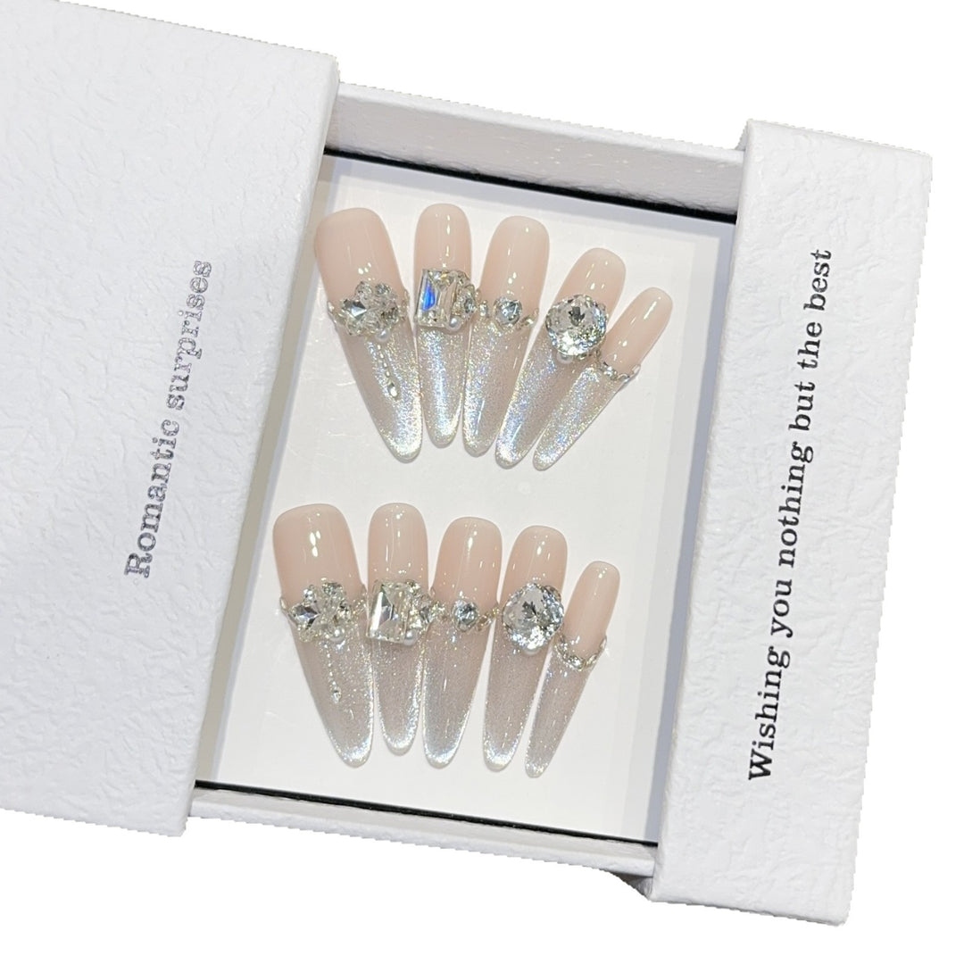 Glamorous artificial nails with sparkling rhinestone embellishments Bowlift