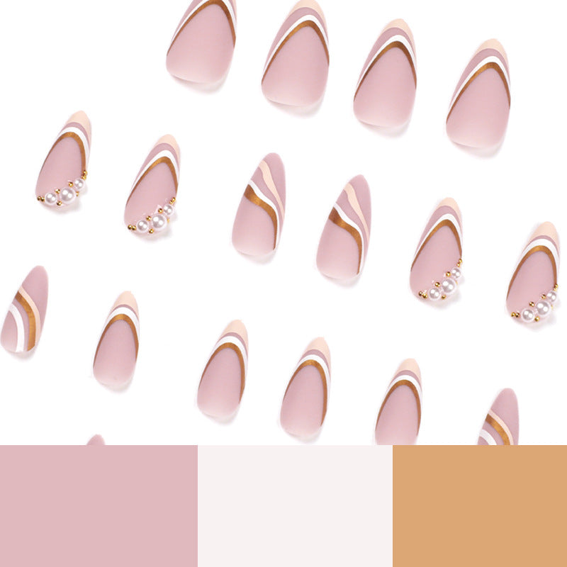 Artful stiletto nails with elegant gold and white accents Bowlift