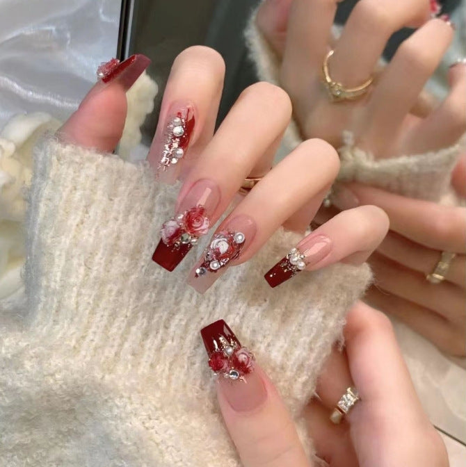 Artistic Nail Art with Glitter and Flower Applications Bowlift