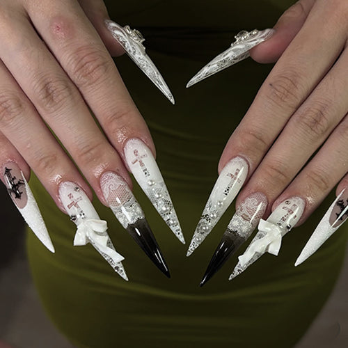 Artful stiletto nails with unique 3D elements and glitter accents Bowlift