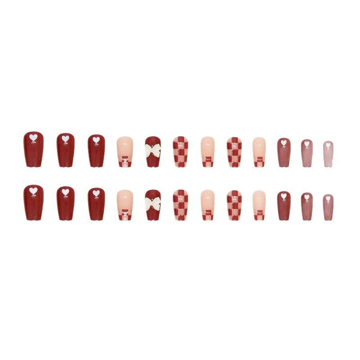 Artificial nails with decorative heart and bow details Bowlift