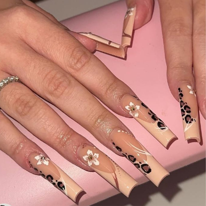 Artistic Long Stiletto Press-On Nails with Floral and Animal Accent Patterns Bowlift