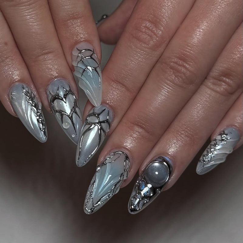 Artful stiletto nails with playful metallic details Bowlift