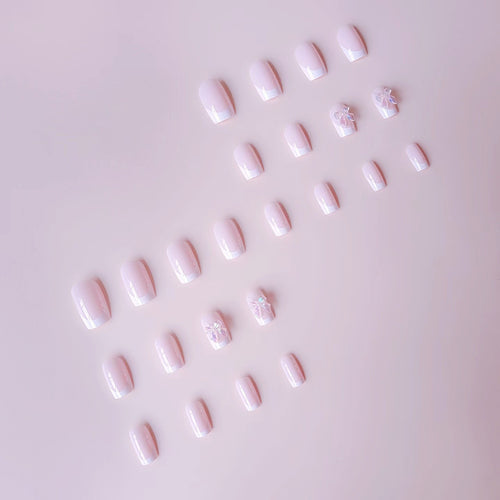 Acrylic nail set with elegant French tips and 3D details Bowlift