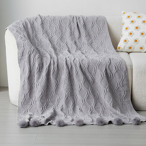 Ladies knit blanket with decorative pom poms Bowlift