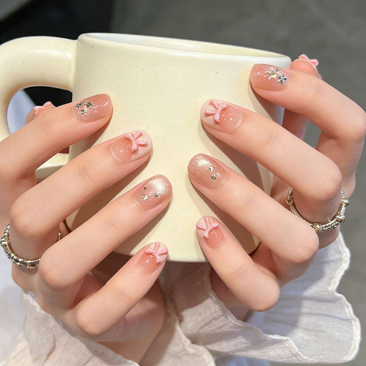 Elegant Nail Art Extensions with Pearl Accents Bowlift