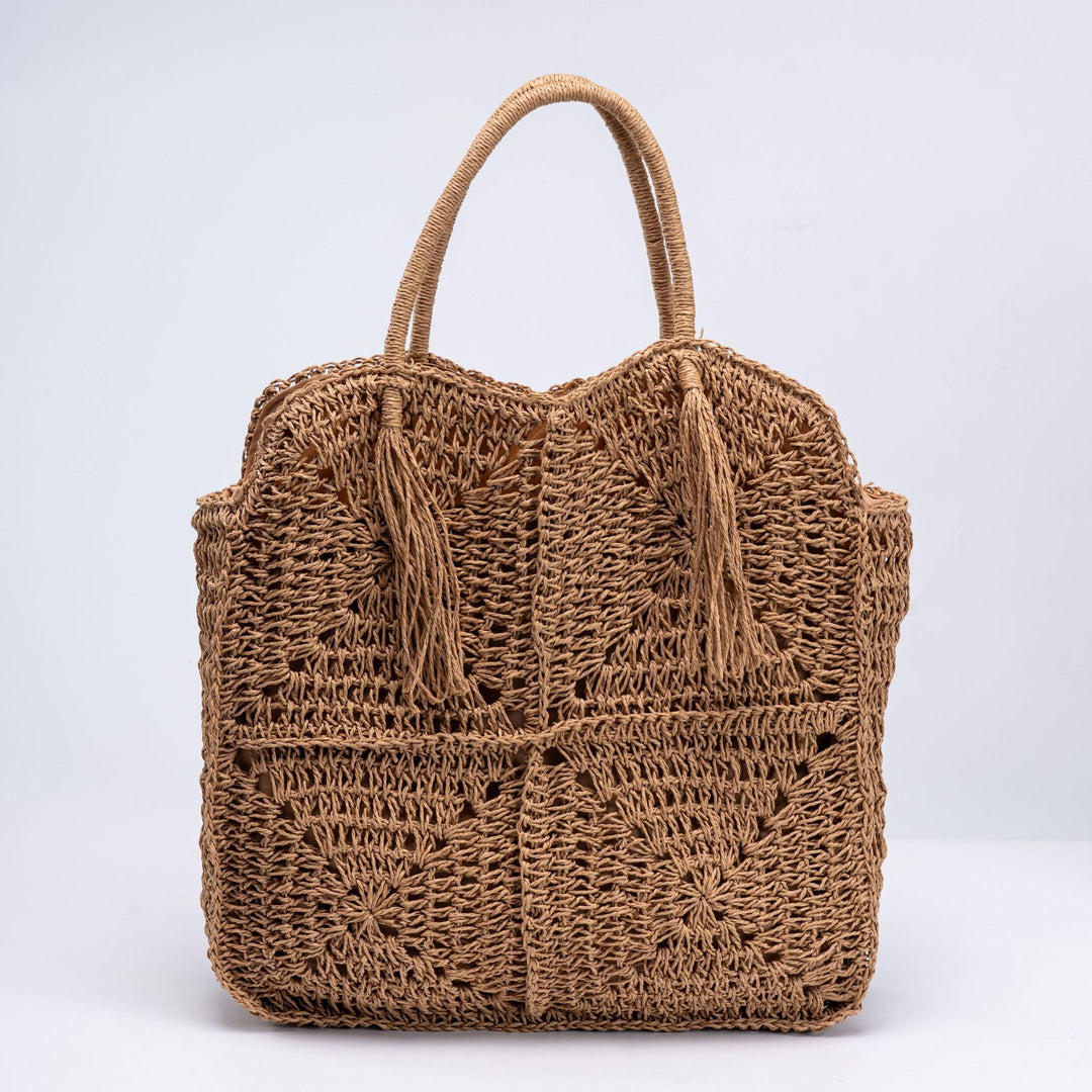 Handcrafted straw beach bag with decorative fringes Bowlift