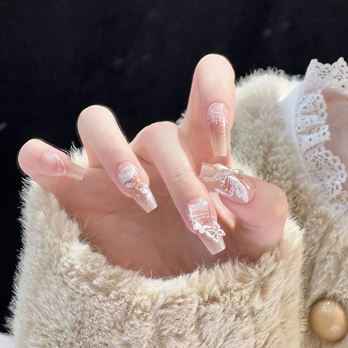 Artful nail design with floral patterns and glitter Bowlift