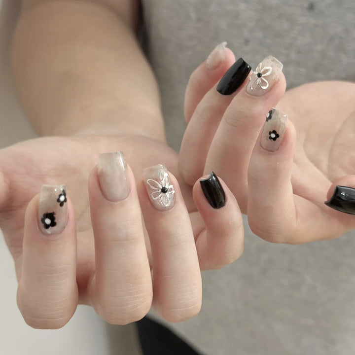 Artistic Press-On Nail Set with Floral and Speckled Design Bowlift