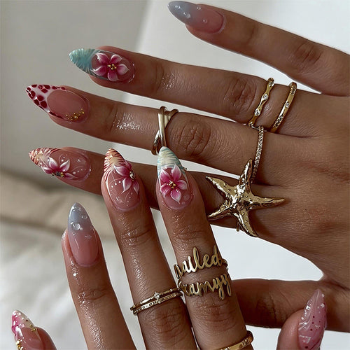 Artificial nail set with floral designs and glamorous accents Bowlift