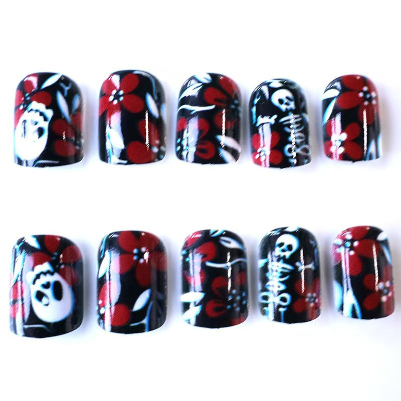 Artificial nail set with creepy skull design and floral accents Bowlift
