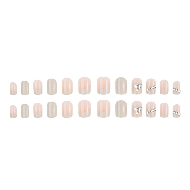 Glamorous artificial nails with heart and rhinestone decorations Bowlift