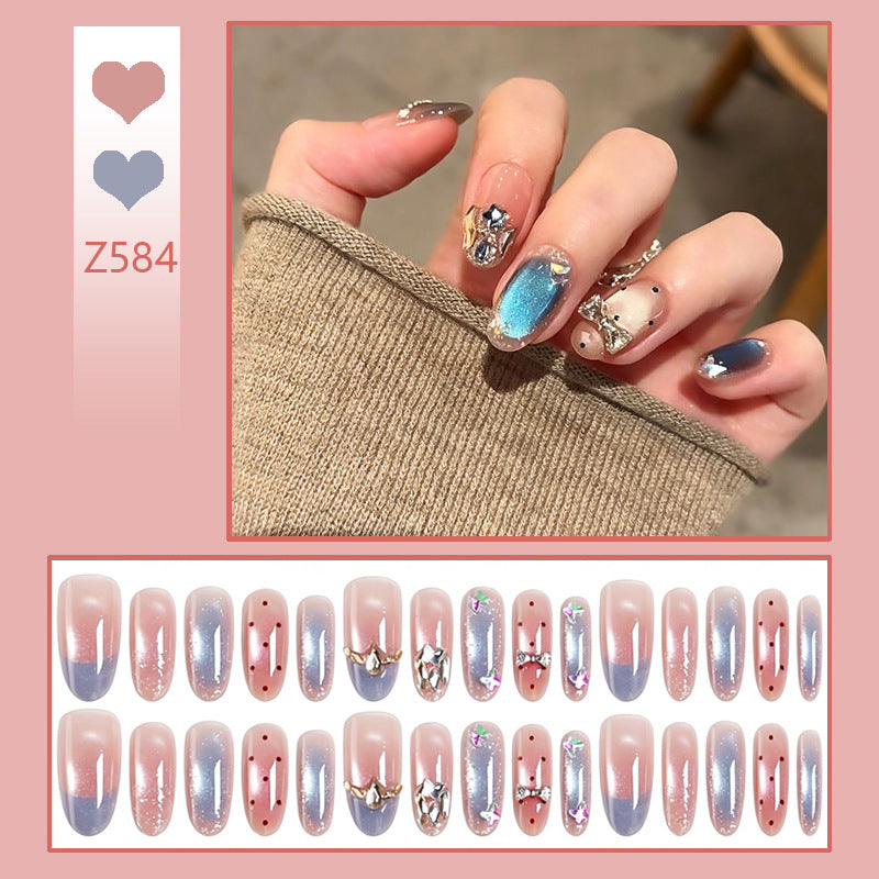 Art nails in elegant premium design with rhinestone and glitter elements Bowlift