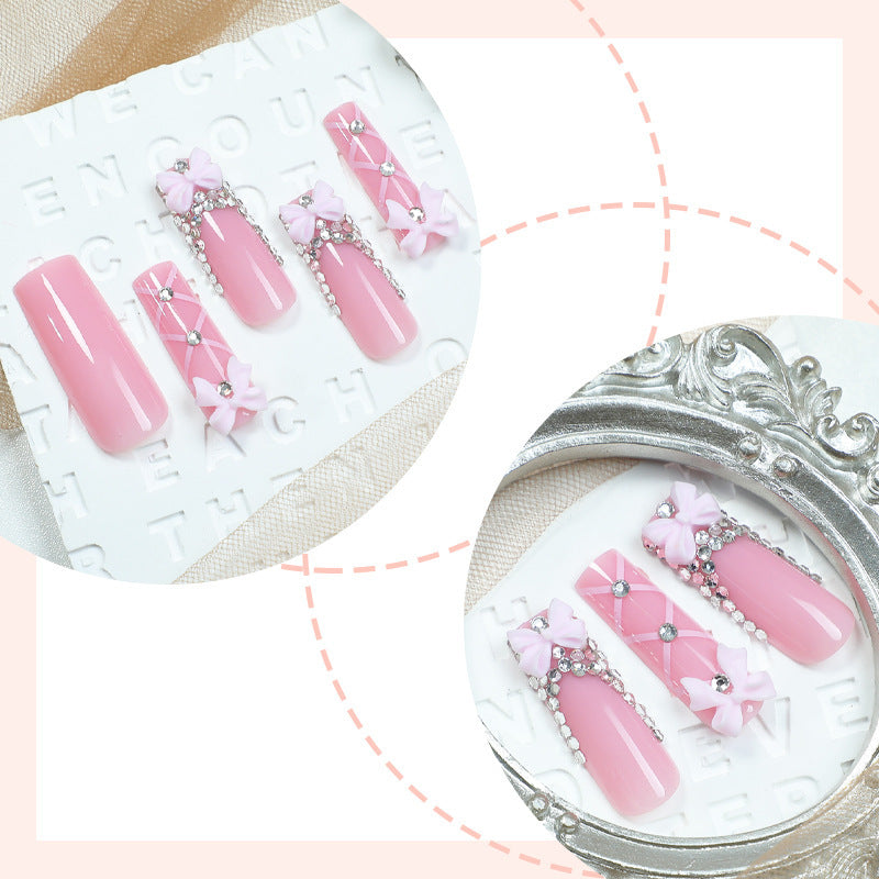 Artificial nail set with romantic bow and glitter accents Bowlift
