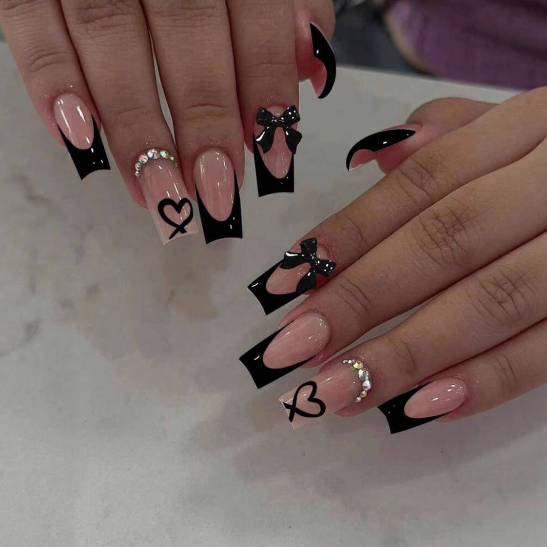 Acrylic nail set with elegant heart and bow design Bowlift