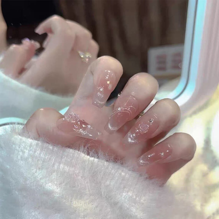 Artistic Press-On Nail Set with Glittery Star Accents Bowlift
