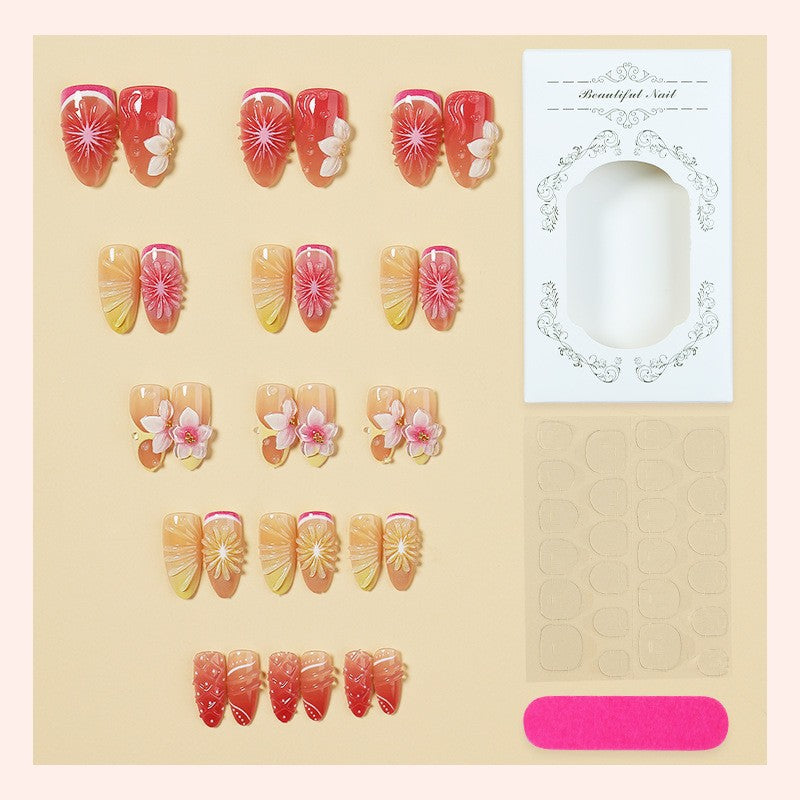Artificial nail set with elegant floral details and glitter effects Bowlift