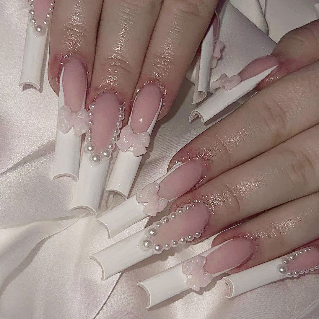 Artistic and elegant acrylic nails with pearl and flower decor Bowlift