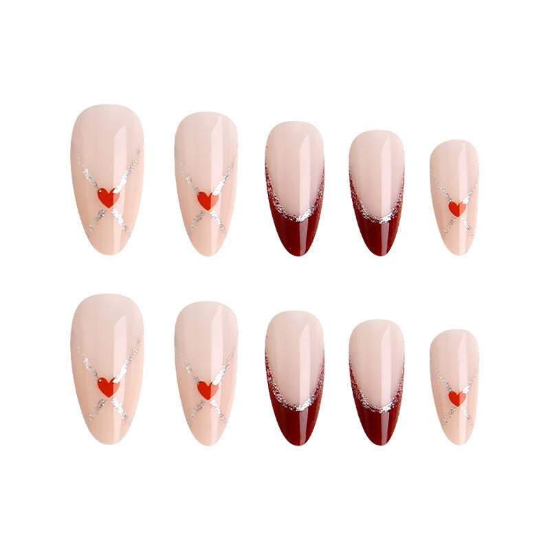 Acrylic nails with heart motifs and glitter details Bowlift