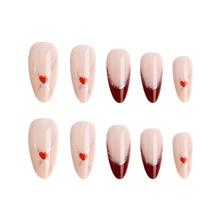 Acrylic nails with heart motifs and glitter details Bowlift