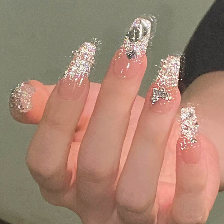 Glamorous artificial nails with sparkling rhinestones and elegant designs Bowlift