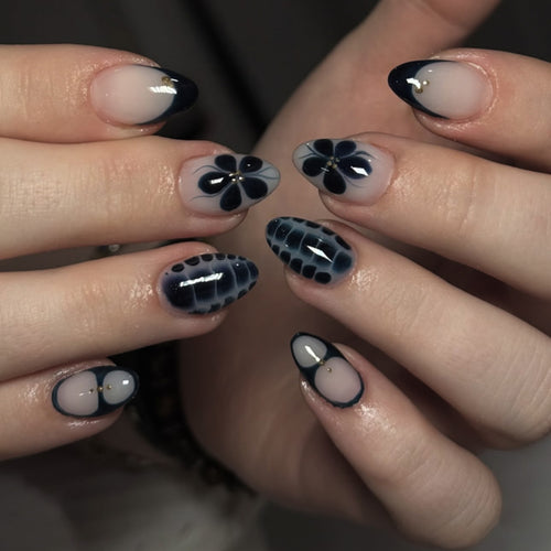 Artful nail art in elegant stiletto design with floral accents Bowlift