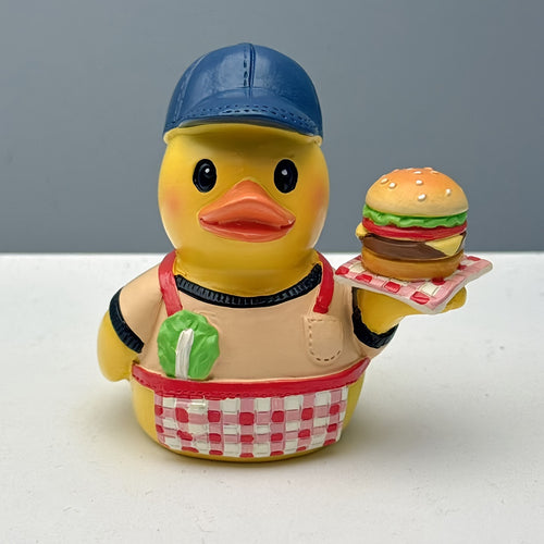 Funny rubber duck as grill master Bowlift
