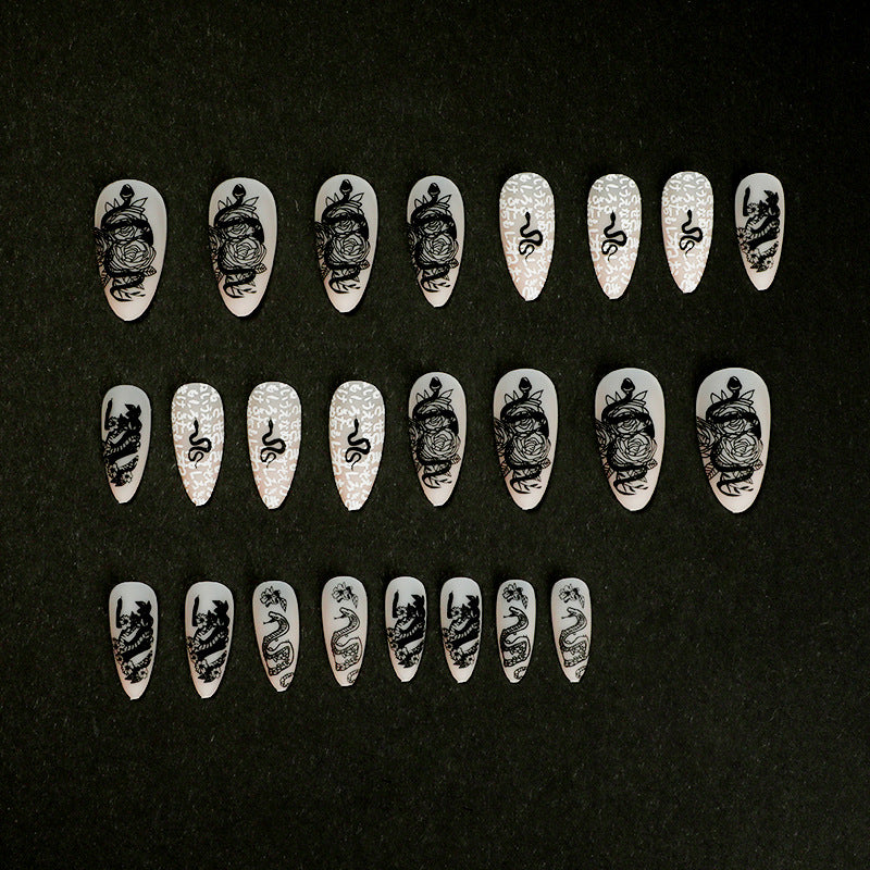 Artful nail extensions in elegant stiletto style with artistic floral and graphic designs Bowlift
