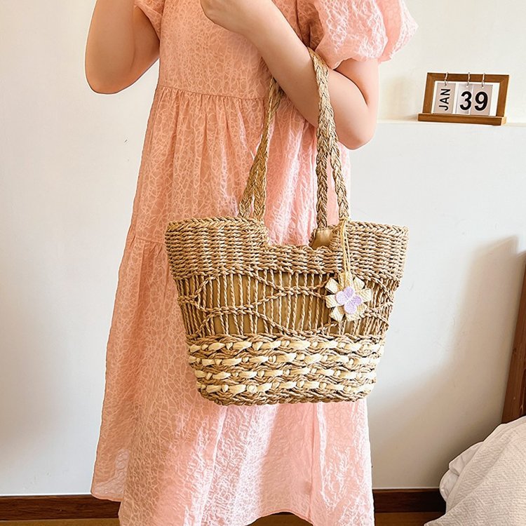 Handwoven beach bag with floral accents Bowlift