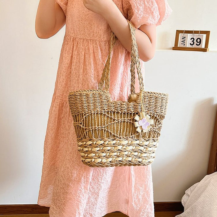 Handwoven beach bag with floral accents Bowlift