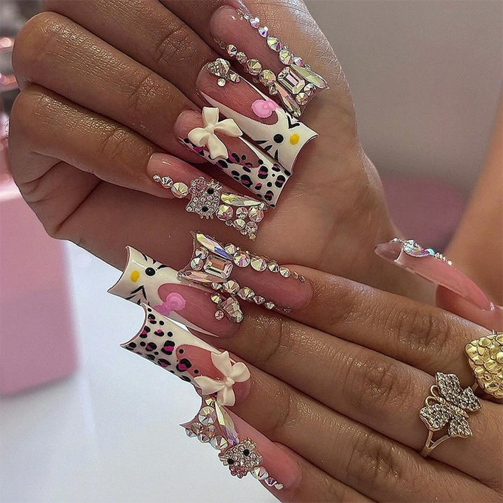 Glamorous artificial nail set with sparkling rhinestone embellishments and creative animal designs Bowlift