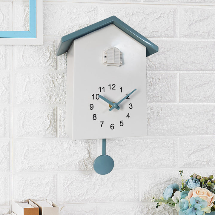 Cuckoo clock in creative house design Bowlift