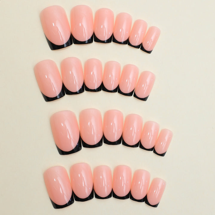 Artificial nail set with elegant French tip design and modern accents Bowlift