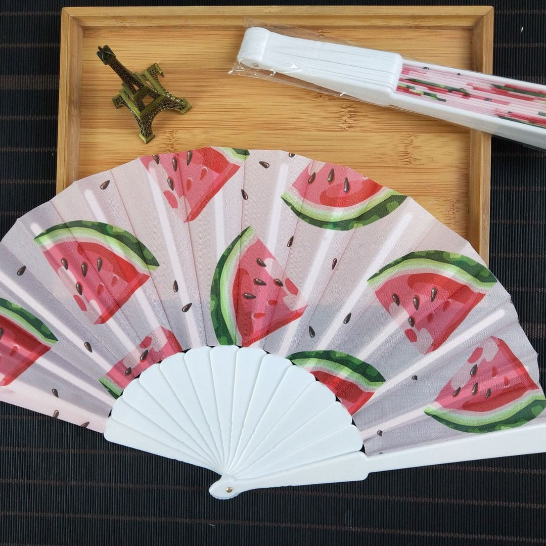 Women folding hand fan with shimmering scale pattern Bowlift