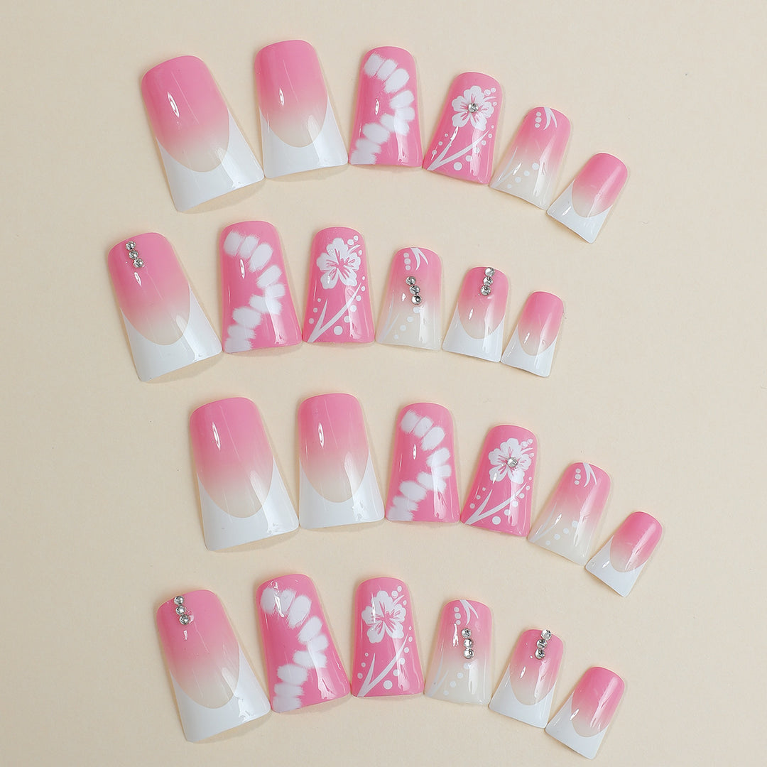 Acrylic nail set with elegant floral designs and glitter accents Bowlift