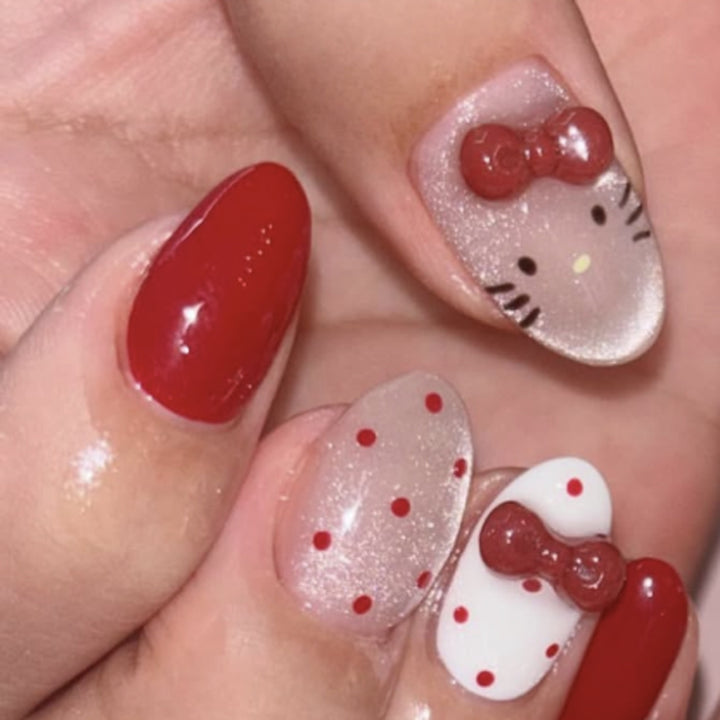 Artificial nail art with playful dots and bows Bowlift