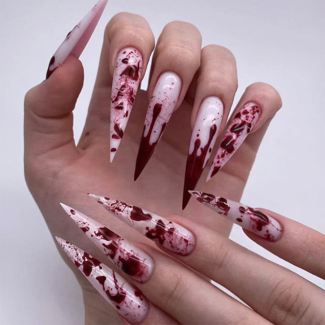 Creative Stiletto Nail Art with Blood Red Accents Bowlift