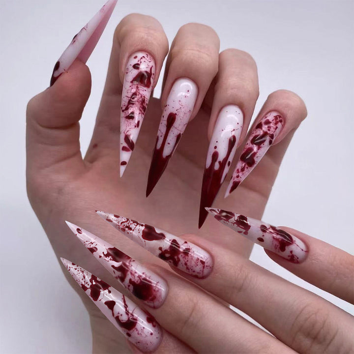 Creative Stiletto Nail Art with Blood Red Accents Bowlift