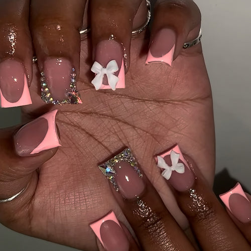 Decorative Acrylic Nail Enhancements with Bow and Rhinestone Accents Bowlift