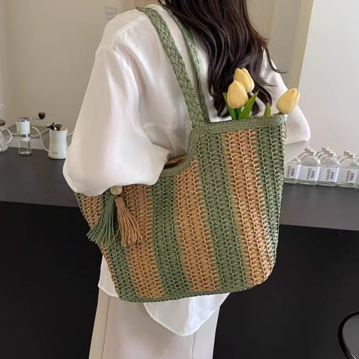 Beach bag with cheerful stripes and tassel details Bowlift