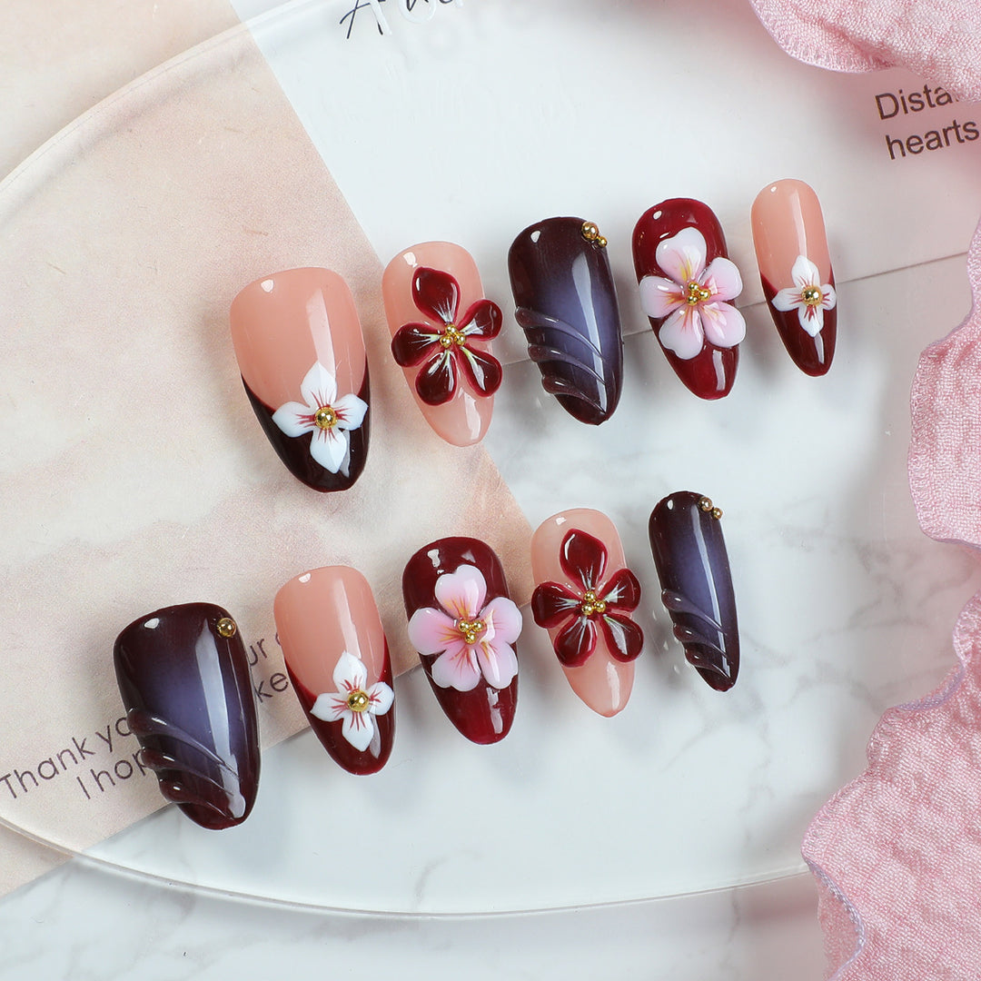 Acrylic nail set with floral accents and luxurious decorations Bowlift