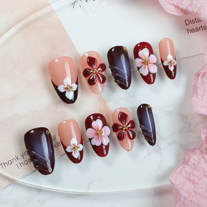 Acrylic nail set with floral accents and luxurious decorations Bowlift