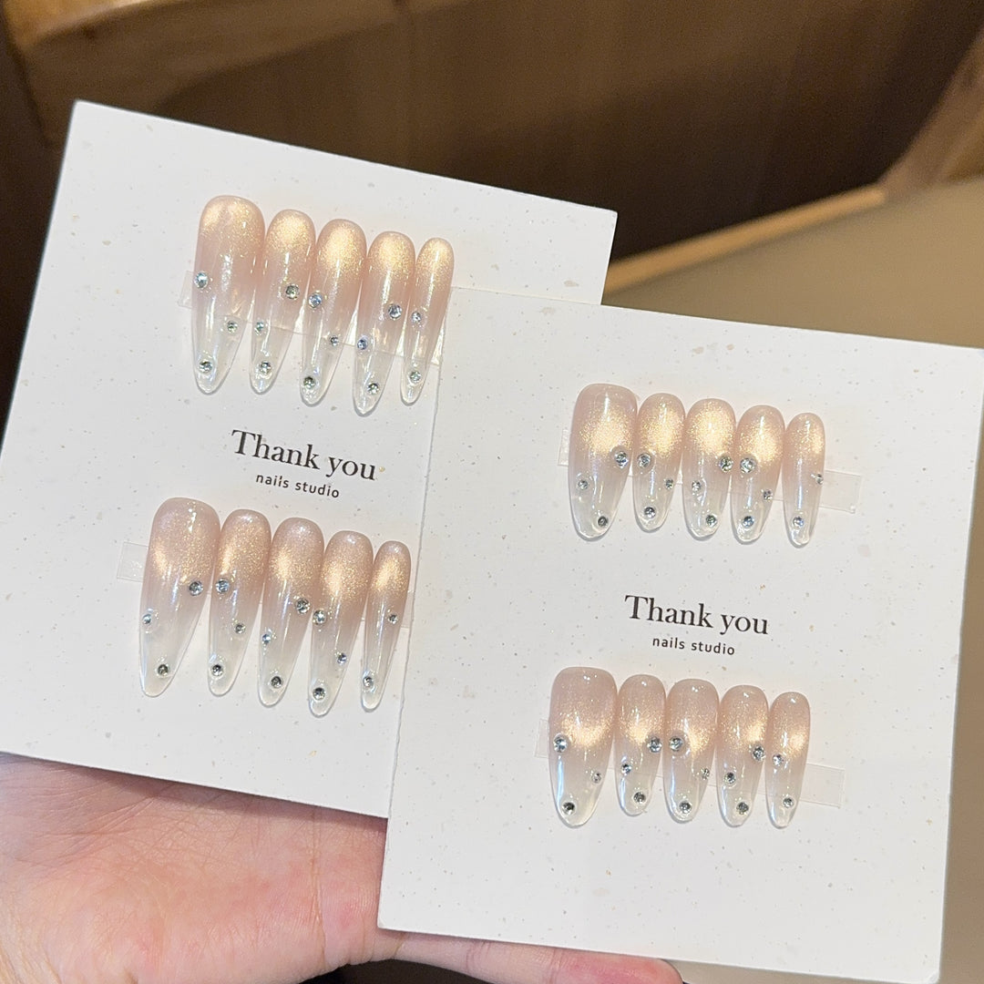 Artificial nails with shimmering accents and elegant rhinestone details Bowlift